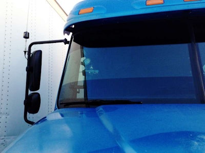 Independent Brad Willis uses a Blue Tiger forward-facing video camera on the windshield of his Freightliner Columbia. “You can set it for the amount of force needed to make it record,” he explains. Otherwise, “it will record in a loop on a mini-SD card,” saving over itself unless triggered manually or by a force incident, such as a hard bump or braking maneuver.
