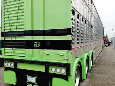 What the above shot doesn’t show is the custom touches on the rear of the Wilson trailer. Says Dan Brubaker: “We had it all custom-painted, put the striping there to match the truck. And we built the light-bar at the bottom and mounted single-hump fenders all across the rear wheels,” certainly rare treatment for a tri-axle cattle trailer, and that’s among other mods you can hear more about in the video below.