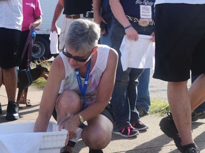 In the on-site truck parking lot, walkers gathered to ice up neck towels provided.