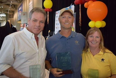 Finalists Brad James (left) and Jennie Simpson show off their hardware at Talent Search finale.