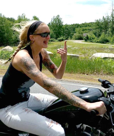 Sometimes Weymouth trades 18 wheels for two – on a motorcycle or a dirt bike. Weymouth gets lots of notice for the tattoos on her arms and back.