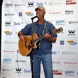 Keith Sampson performing “The Woman Behind the Man Behind the Wheel” at the Trucker Talent Search finale Aug. 22 at GATS.
