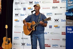Keith Sampson performing “The Woman Behind the Man Behind the Wheel” at the Trucker Talent Search finale Aug. 22 at GATS.
