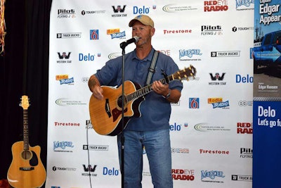 Keith Sampson performing “The Woman Behind the Man Behind the Wheel” at the Trucker Talent Search finale Aug. 22 at GATS.