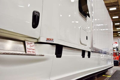 Fort Wayne, Ind.-based Bolt Custom Trucks built the fully integrated-style custom sleeper on the 2015 Freightliner Cascadia for FedEx Custom Critical-leased Bob and Linda Caffee, likewise building out the fairing treatment the length of the box, utilizing Freightliner stock side fairings with their own custom modifications. The truck is powered by a 380-hp Detroit DD13 and DT12 transmission.