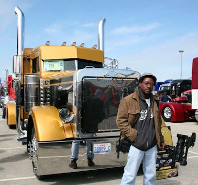 Fiffie, picture above by Cheri Kimball at the Mid-America Trucking Show, has found a home covering the trucking world, he says. He got his start in video production with an early interest in cameras that ultimately led to a small business producing television commercials and variety of other work. Before that, though, he needed seed money to invest in the necessary equipment, well before digital video made that at least somewhat less cumbersome of a prospect. “I looked for a job,” he says, and “worked for my father as a mechanic” in his auto-repair shop in South Florida. Cue then a story in the local newspaper comparing various income numbers for particular professions, in which truck drivers and machine operators ranked quite high. “My next-door neighbor was a truck driver,” Fiffie adds. “I went for a ride with him once and then got my Class A, taking the money I made and buying video equipment with it.” Over four or five years, he’d built his arsenal “and was able to transition to a business doing video production.” Along the way, though, he never lost the interest in trucks and trucking. In 2006 he moved from South Florida to the West Coast of Florida to a small town with no video services. But “I wanted to explore,” he says. “I thought I’d take a driving job,” his first operating a Peterbilt, a 2006 triaxle 379 with 500 horses. “I really got hooked.” His video business hit hard locally by the economic crash a few years later, a friend mentioned the Chrome Shop Mafia was looking for “someone to come up to the Mid-America Trucking Show in 2012” to film the show for a DVD. That’s where the 4 State Trucks DVD series got its start, and with all the extra footage, Fiffie took to Youtube and Facebook, further developing ideas like the Rolling CB Interviews series.