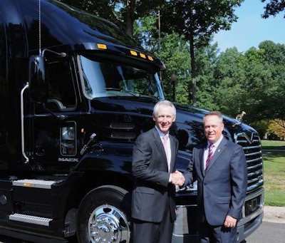Mack President Stephen Roy (right) presents ATA President and CEO Bill Graves with a 2014 Mack Pinnacle for use in ATA’s Share the Road program.