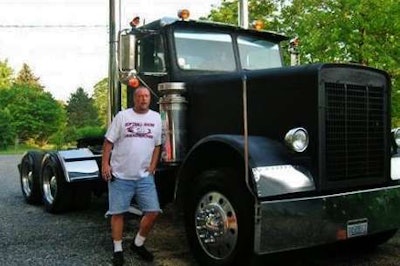 Timbrook several years back with one of his former small fleet trucks, a 1982 Freightliner daycab