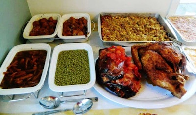 The menu: Ham, turkey both fried and baked, chicken, dressing, potato salad, mashed potatoes, yams, peas, green beans, deviled eggs, cranberry sauce, gravy and giblets gravy, rolls and desserts, including some sugar-free options. “We cook in shifts,” says Bettina Cameron, “because the drivers come and go all day and night.” The pictures here are from a past Thanksgiving gathering.