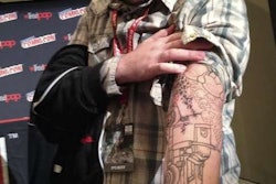 Former Austin, Texas, comics store owner Cates, pictured above, tattoed his right arm with an illustration based on one of the panels in the comic to, in Hollis’ words, “remind him of the deadlines that hang over his head now that he is a successful comic book author.”
