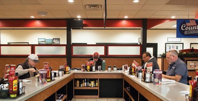 From images like the one above, of the professional drivers’ counter from the point of view of TA wait staff, to driver portraits shot in-cab, Irvin’s work is the kind of honest portrait that the trucking world could use more of.