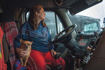 There’s a bit of good related news on that score. Irvin notes in the text accompanying the photo essay that the project has inspired her to do more with the subject of trucking: “This early morning introduction has inspired me to pursue the truck stop as a longer-term project.” The driver shown above, Kit from Pennsylvania, was among Irvin’s photo subjects. Click through this link or either of the above images for more.