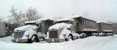 Blast from the past: Cindy Vince shared this shot of two Michigan gravel trains from the frigid 2014 winter in Lake Orion, Mich.: “We haul bulk road salt. They were shoveled out and put to work the following day.”