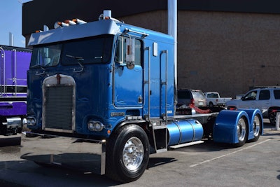 This Kenworth bears “Old Iron Special” on the back of the cab.