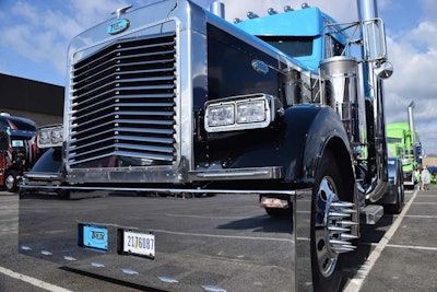 Signage on this 2004 Pete indicates a number of customizers had a hand in its muscular look.