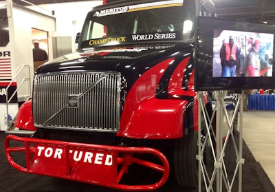 On display at the Minimizer company’s booth at the Mid-America Trucking Show is this Volvo ChampTruck, one of two the company has entered in the ChampTruck race series, getting under way next month.