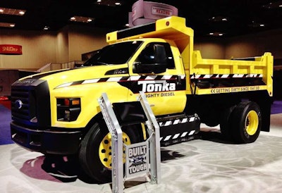 “When the sheet was lifted off the mystery truck at the end of Ford’s presentation to kick off the 2015 Work Truck Show” last week, reported Bruce Smith of Hardworkingtrucks.com, “no one expected to see their favorite toy: a Tonka Dump Truck.”