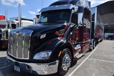 Longhaul Trucking’s 2016 Pete 579 has a subtle but striking graphic pattern of dark red and black, which matches on tractor and curtainside trailer. Longhaul is based in Albertville, Minn.