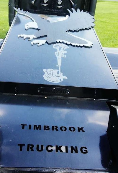 Among the last additions to matte-black painted daycab was this wood-worked eagle bolted above the helmet, gun and boot on the custom fifth wheel cover by Hopewell Sheet Metal of Hagerstown, Md., which also did the deckplating work. (See the galleries below for more images.) The eagle is the work of a Marine Corps veteran and friend Timbrook knows from the local bowling alley. “He’s 75 years old, and I know him just as Pappy,” Timbrook says. “He called me up one day and said, ‘I have something for your truck for you,'” and that he’d be honored if Timbrook used it. “I said, ‘I sure will.'”