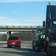 Truck being towed on highway
