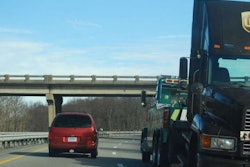 Truck being towed on highway