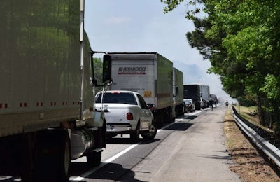 The culprit for the stop? It wasn’t an accident. When I peered around the FedEx Ground 53-footer parked in front of me, this is what I saw.