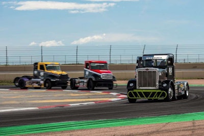 Allen Boles Pete 359 racer followed by a pack of racers.