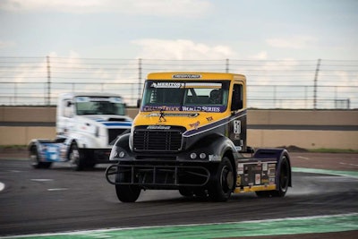 Oliver's No. 31 Freightliner leading the pack, with Hungarian racer Krisztian Szabo's No. 23 Bendix-sponsored Volvo following close behind.