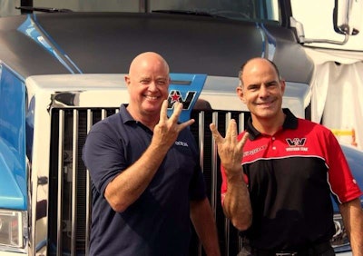 Daimler Trucks’ Guy Lemieux (right) presented OOIDA’s Mike Schermoly (left) with the keys to a Western Star 5700 XE at the Walcott Truckers Jamboree last week. Here, the two show off their Western Star W’s.