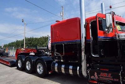 While 'most of my lowboy trucks are white,' Williams says, the red-and-black primary colors of Contender reflect the scheme of the remainder of the fleet.