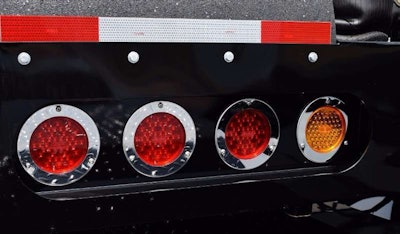 Rounds for tail-lights are repeated throughout both truck and trailer, here shown at the rear of the RGN.
