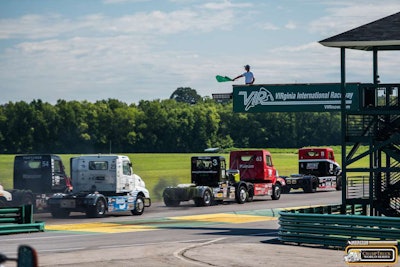 The pack of racers crossing the finish line during one of the weekend's heat races.