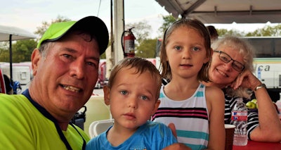 Buchs (left) with his wife, Marcia, and grandsons Henry (4) and Anna (6).
