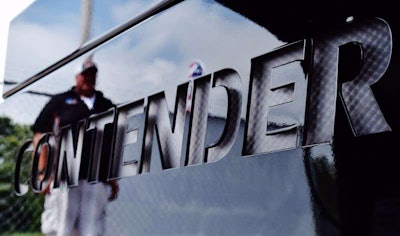That's Williams reflected across the custom back-lit lettering in Contender's tractor's bumper.