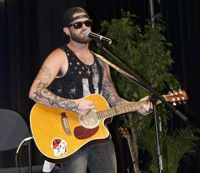 Trucker Nate Moran performing “Middle of the Moonlight” at the Trucker Talent Search finale.