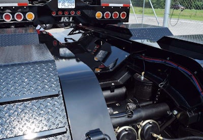 Detail toward the rear of the heavy-hauler. Note the upside-down license plate on the auxiliary axle, flipped up for display.