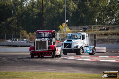 Ricky ‘Rude’ Proffitt (red and black Peterbilt) and Krisztian Szabo (white and blue Volvo) battle for position.