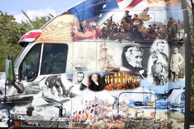 The truck is wrapped with depictions of ten wars, beginning with the Revolutionary War, and covering the War of 1812, The Civil War, WWI, WWII, Korea, Vietnam, Desert Storm, Enduring Freedom and the Iraq war. There are images of soldiers from every branch of the military, and the layout is just awesome.
