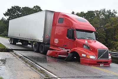 Click through this image by photographer Rick Carpenter of the Sumter Item for the story of trucker Marin Anguelou, who got stuck at this bridge break on U.S. 15 near Sumter, S.C., after it fell out from under the rear of the truck ahead of him.