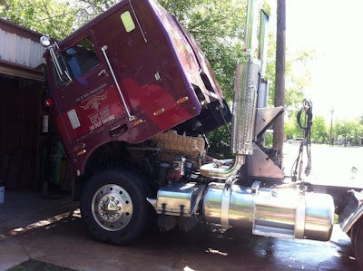 A view during some maintenance under way -- Beadle says he does most of his own work on the truck, greasing at least every two weeks in addition to inspecting daily. At once, 'I hired a friend of mine who operates a mobile mechanic service to overhaul my engine this past April,' says Beadle. 'I test all oil samples. I change oil on my gears and transmission regularly, and I even service my 5th wheel every two weeks. My cab gets just as much attention as any running part of the truck.'