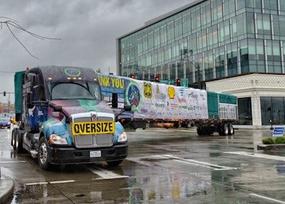 Lynden Transport driver John Schank makes a turn in the Belltown District of Seattle as it makes its way to Lake Union Park.