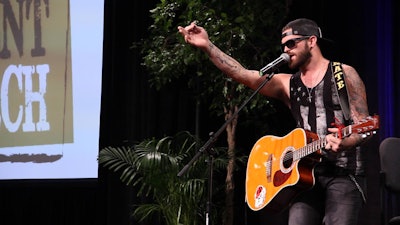 Trucker Talent Search winner Nate Moran performs “Middle of the Moonlight” at The Great American Trucking Show in Dallas.