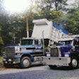 Two of Toms’ dump trucks — he’s a “third-generation dump truck owner in Maryland,” he says.