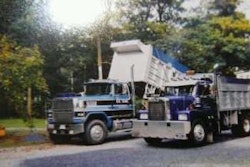 Two of Toms’ dump trucks — he’s a “third-generation dump truck owner in Maryland,” he says.
