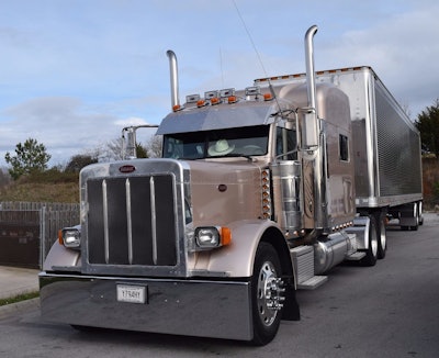 Justice's 2006 379, his trademark cowboy hat visible on the dash below.