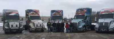 CTS is honoring military veterans with trucks wrapped to honor each branch of the U.S. military. Shown are CTS’ veteran drivers and the wrapped trucks.