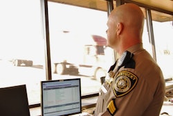 Officer-screening-trucks-for-inspection-in-kentucky-bypass