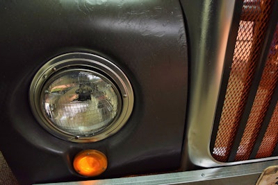 Detail of the paint work, preserving an antique feel, and part of the custom additions to the desk's grille.