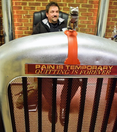 Unforeseen bonus to the mirrored backing behind the grille -- no, those aren't Blanchard's own legs and shoes under the desk but rather my own. A visitor pointed the optical illusion out to him shortly after he installed the desk, he says.