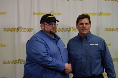 Goodyear Marketing Manager Gary Medalis, right, congratulates Julian Kaczor following the March 31 announcement.